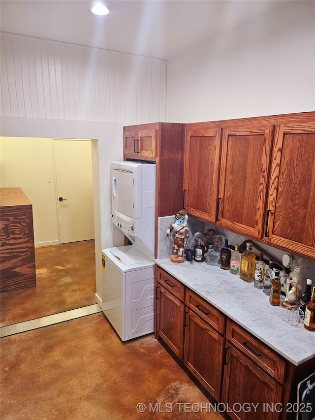 2417 Wilson St, Durant, OK 74701 - laundry area with stacked washing machine and dryer