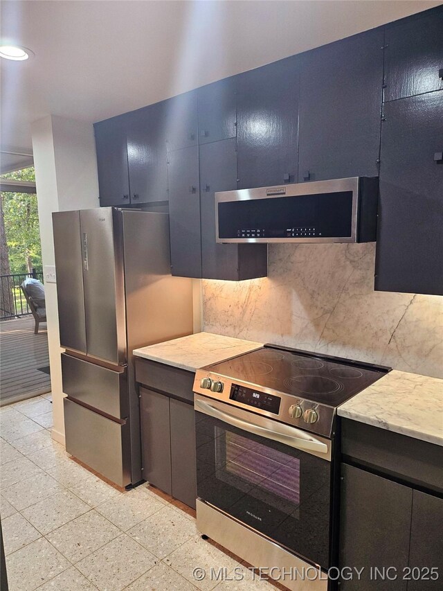 2417 Wilson St, Durant, OK 74701 - kitchen with stainless steel appliances, extractor fan, tasteful backsplash, recessed lighting, and granite tiled floors