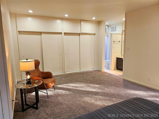 2417 Wilson St, Durant, OK 74701 - living area featuring carpet floors and recessed lighting