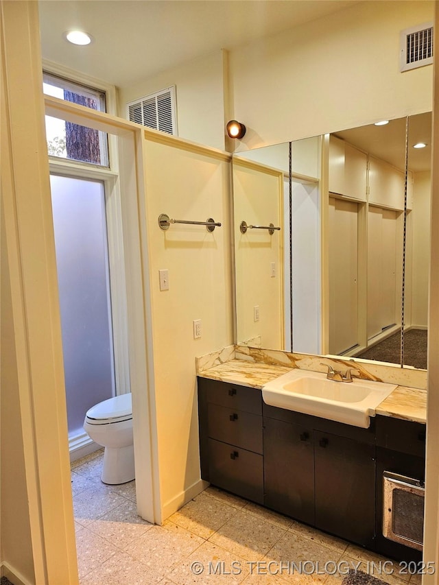 2417 Wilson St, Durant, OK 74701 - full bathroom featuring vanity and recessed lighting