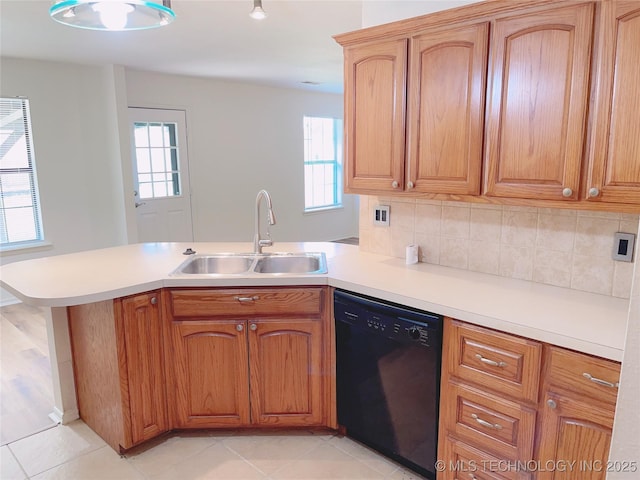 102 Northridge, Durant, OK 74701 - kitchen featuring dishwasher, a peninsula, light countertops, backsplash, and light tile patterned floors