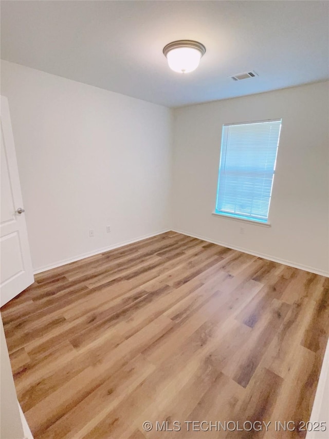 102 Northridge, Durant, OK 74701 - unfurnished room with wood finished floors