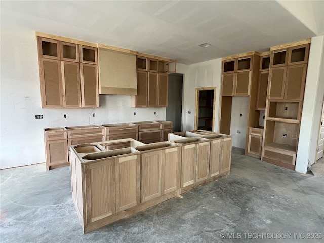 23191 E 107th St, Broken Arrow, OK 74014 - kitchen featuring a center island, unfinished concrete floors, and premium range hood