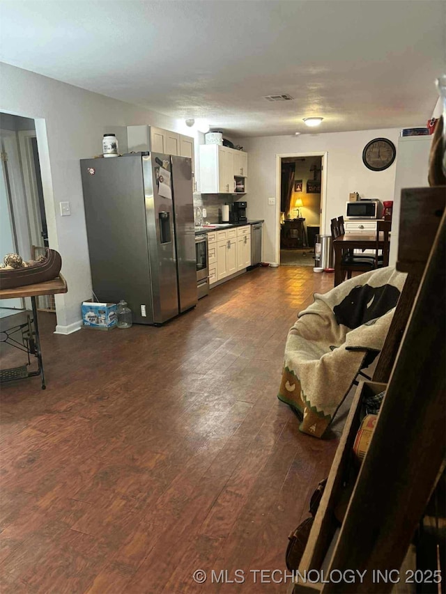 24 Lakeside, Adair, OK 74330 - living room with dark wood-style floors
