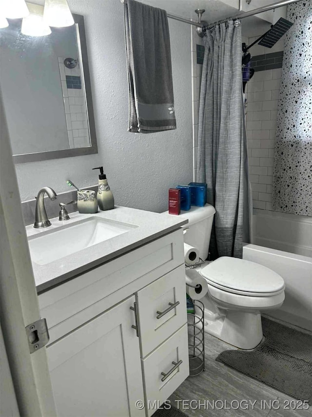 24 Lakeside, Adair, OK 74330 - bathroom with a textured wall, vanity, shower / tub combo, and wood finished floors