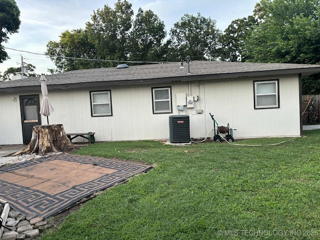 24 Lakeside, Adair, OK 74330 - rear view of property with a yard, a patio area, and a shingled roof