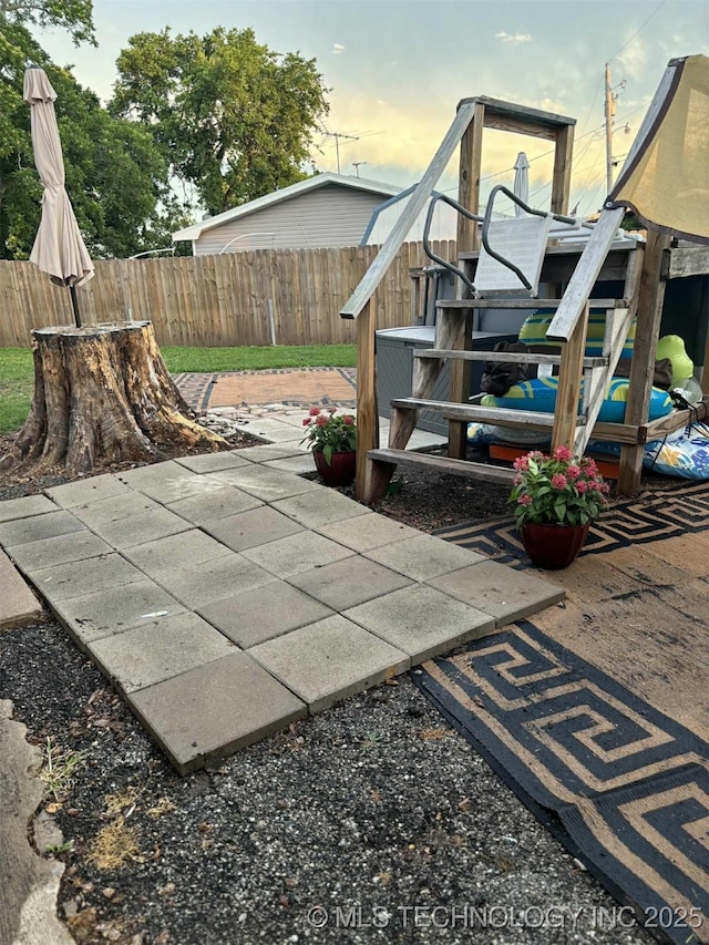 24 Lakeside, Adair, OK 74330 - patio terrace at dusk with a patio area