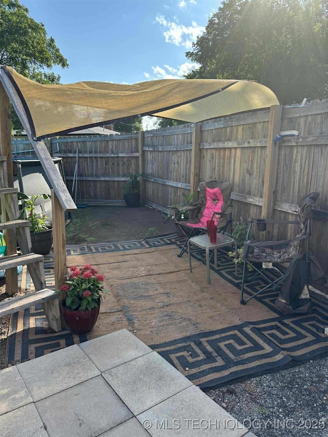 24 Lakeside, Adair, OK 74330 - fenced backyard with a patio area