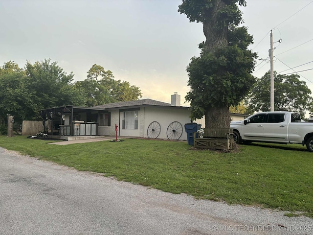 24 Lakeside, Adair, OK 74330 - ranch-style home featuring a front yard and a chimney