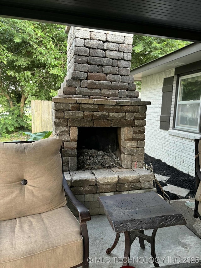 24 Lakeside, Adair, OK 74330 - view of patio / terrace with an outdoor stone fireplace