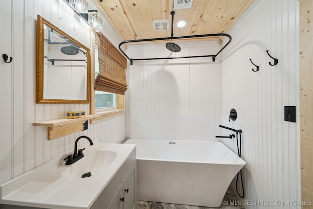 8620 N 155th Rd, Beggs, OK 74421 - bathroom featuring a soaking tub, wood ceiling, vanity, and a decorative wall