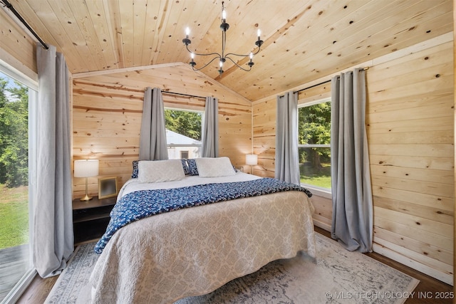 8620 N 155th Rd, Beggs, OK 74421 - bedroom featuring wooden walls, vaulted ceiling, a chandelier, wood ceiling, and wood finished floors
