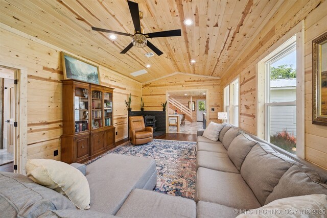 8620 N 155th Rd, Beggs, OK 74421 - living area with wood walls, wooden ceiling, vaulted ceiling, ceiling fan, and wood finished floors