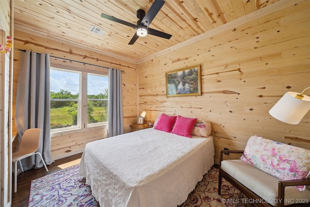 8620 N 155th Rd, Beggs, OK 74421 - bedroom featuring wood ceiling, wooden walls, ornamental molding, wood finished floors, and a ceiling fan