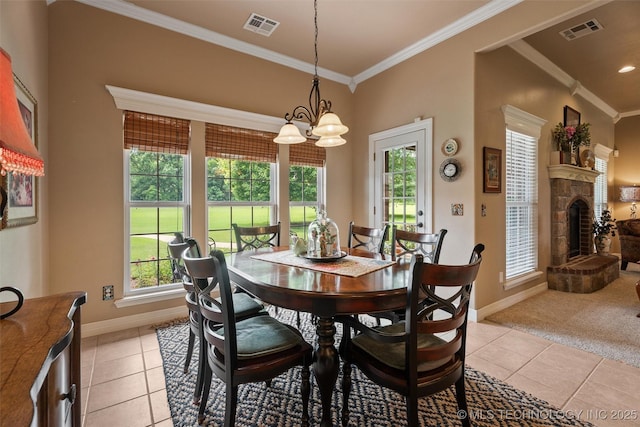 18 Longacre Dr, Ramona, OK 74061 - dining room featuring crown molding, light tile patterned flooring, plenty of natural light, and a stone fireplace