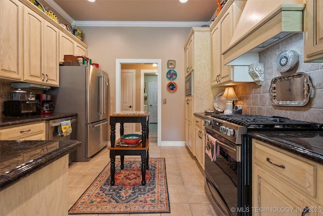18 Longacre Dr, Ramona, OK 74061 - kitchen featuring stainless steel appliances, light brown cabinets, ornamental molding, tasteful backsplash, and dark stone countertops