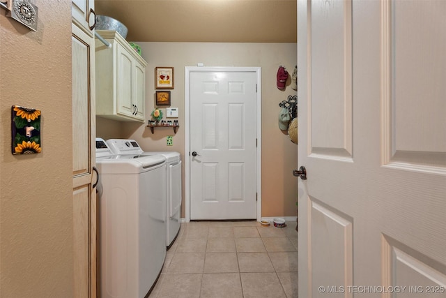 18 Longacre Dr, Ramona, OK 74061 - washroom featuring washing machine and dryer, light tile patterned floors, and cabinet space
