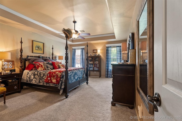 18 Longacre Dr, Ramona, OK 74061 - carpeted bedroom featuring a tray ceiling and a ceiling fan