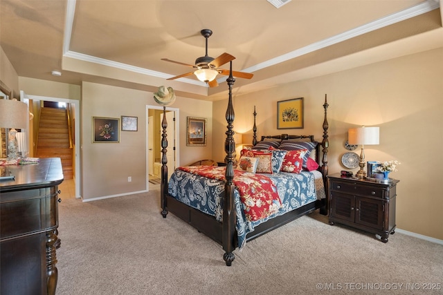 18 Longacre Dr, Ramona, OK 74061 - bedroom featuring a tray ceiling, carpet, ornamental molding, ceiling fan, and ensuite bath