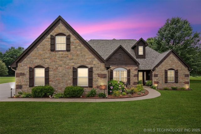 18 Longacre Dr, Ramona, OK 74061 - french provincial home with stone siding, a yard, and roof with shingles