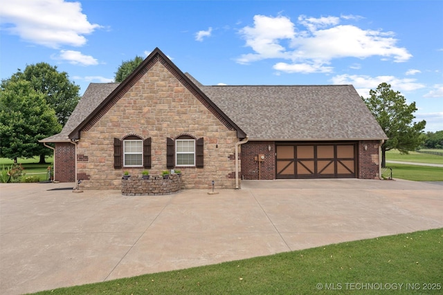 18 Longacre Dr, Ramona, OK 74061 - view of front of house with stone siding, a shingled roof, driveway, and a garage