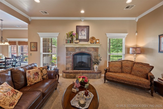 18 Longacre Dr, Ramona, OK 74061 - carpeted living area with ornamental molding, plenty of natural light, recessed lighting, a stone fireplace, and a chandelier