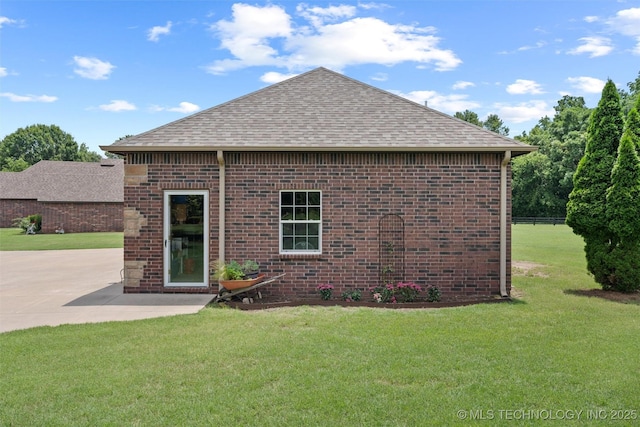 18 Longacre Dr, Ramona, OK 74061 - view of home's exterior with roof with shingles, brick siding, a lawn, and a patio