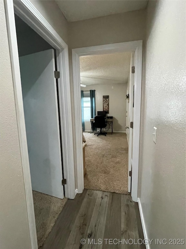 3800 S Narcissus Ave, Broken Arrow, OK 74011 - hall with a desk and wood finished floors