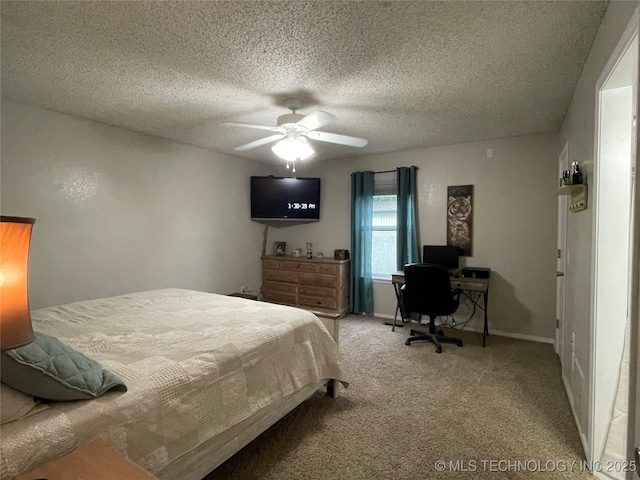 3800 S Narcissus Ave, Broken Arrow, OK 74011 - carpeted bedroom featuring a ceiling fan, a textured ceiling, and an office area