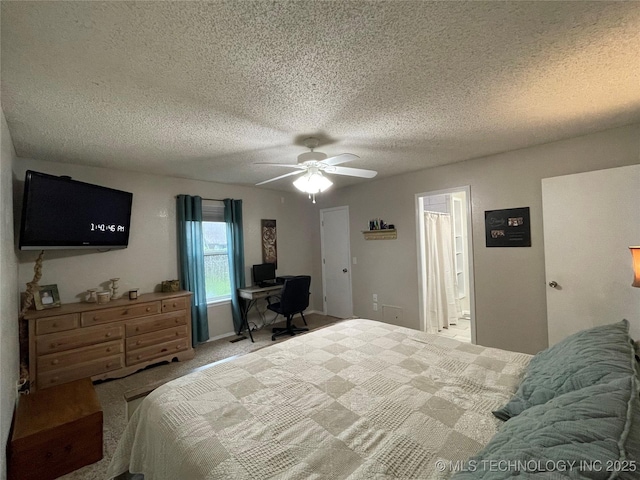 3800 S Narcissus Ave, Broken Arrow, OK 74011 - carpeted bedroom with a desk, a textured ceiling, ceiling fan, and connected bathroom