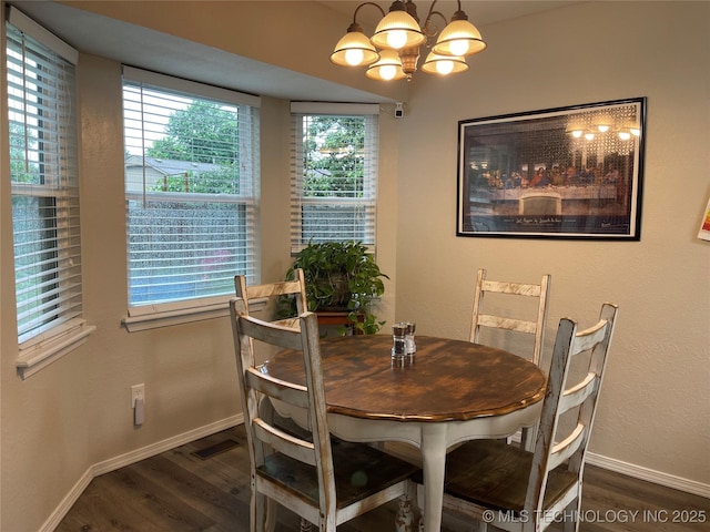 3800 S Narcissus Ave, Broken Arrow, OK 74011 - dining space featuring wood finished floors, a chandelier, and plenty of natural light
