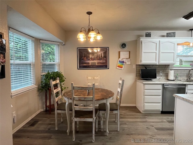 3800 S Narcissus Ave, Broken Arrow, OK 74011 - dining area featuring light wood-type flooring and a chandelier