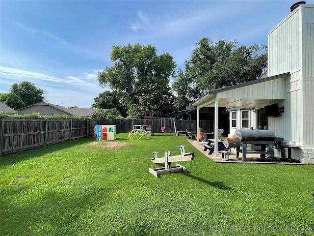 3800 S Narcissus Ave, Broken Arrow, OK 74011 - fenced backyard with a patio