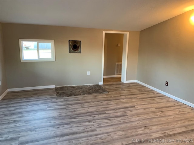 8201 State Highway 20, Eucha, OK 74342 - spare room with wood finished floors and baseboards