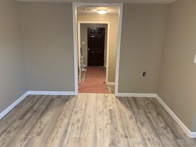 8201 State Highway 20, Eucha, OK 74342 - unfurnished room featuring wood finished floors and baseboards