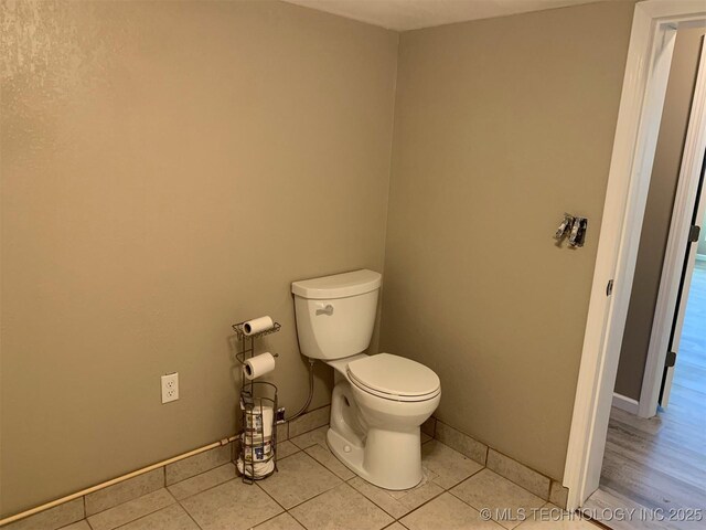 8201 State Highway 20, Eucha, OK 74342 - bathroom featuring toilet and tile patterned floors