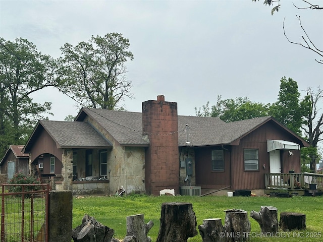 8201 State Highway 20, Eucha, OK 74342 - view of front facade with roof with shingles, a chimney, and stone siding