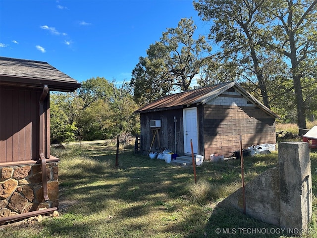 8201 State Highway 20, Eucha, OK 74342 - view of green lawn featuring entry steps and an outbuilding