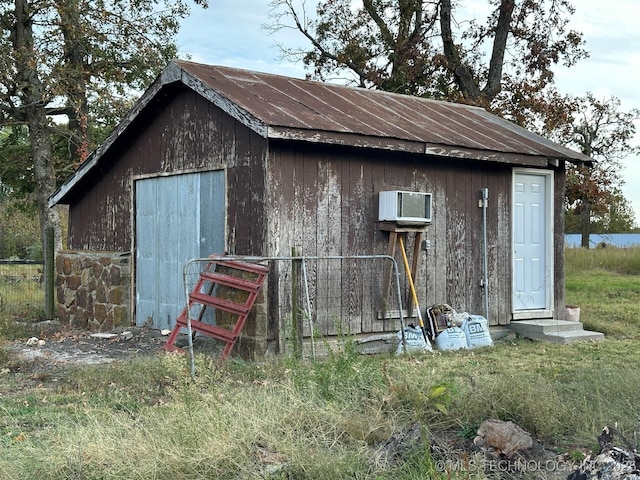 8201 State Highway 20, Eucha, OK 74342 - view of outbuilding with a wall mounted air conditioner