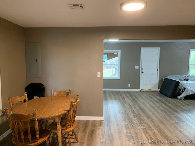 8201 State Highway 20, Eucha, OK 74342 - dining room with electric panel and wood finished floors