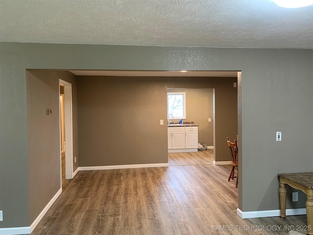 8201 State Highway 20, Eucha, OK 74342 - empty room featuring a textured ceiling and wood finished floors