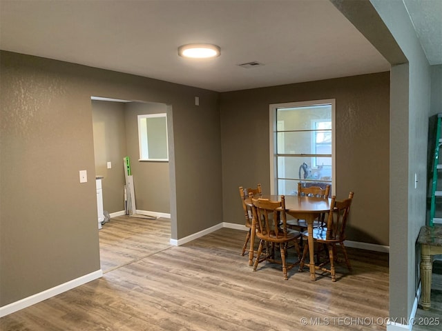 8201 State Highway 20, Eucha, OK 74342 - dining area with wood finished floors and healthy amount of natural light