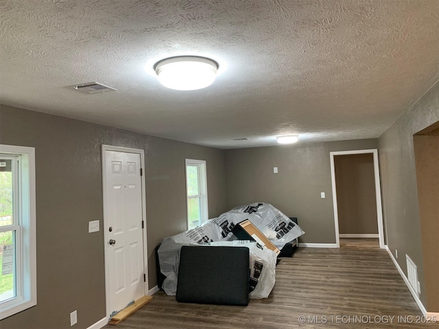 8201 State Highway 20, Eucha, OK 74342 - living area with a textured ceiling and wood finished floors
