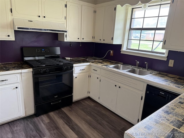 303 N 6th, Calera, OK 74730 - kitchen with under cabinet range hood, black appliances, white cabinetry, and dark wood-style floors