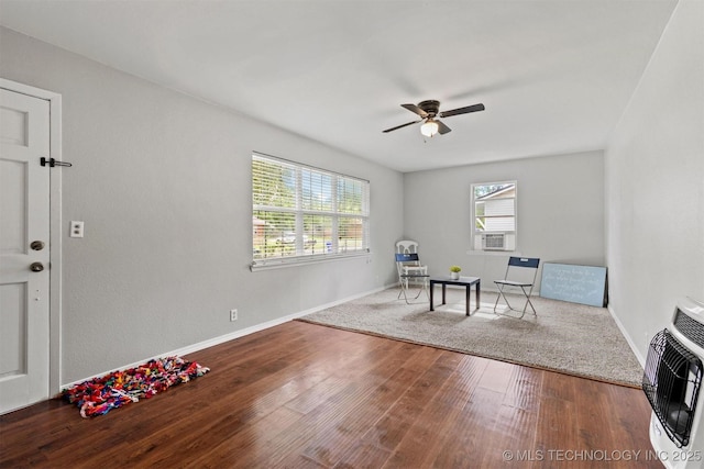 707 Bradwell St, Colbert, OK 74733 - sitting room featuring a ceiling fan, heating unit, and wood finished floors