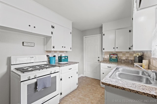 707 Bradwell St, Colbert, OK 74733 - kitchen featuring white range with gas cooktop, white cabinetry, and light countertops