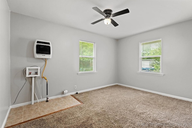 707 Bradwell St, Colbert, OK 74733 - spare room featuring heating unit, healthy amount of natural light, carpet flooring, and a ceiling fan
