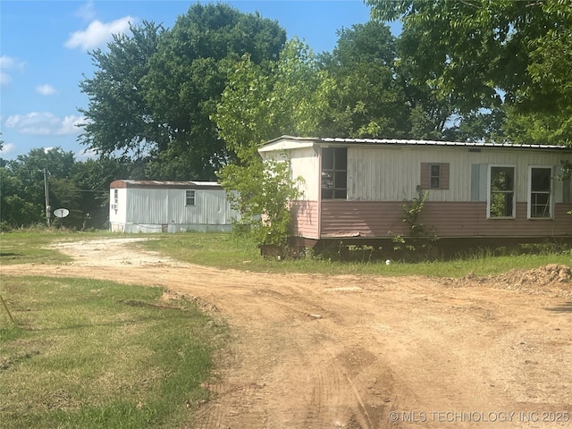 3300 Mississippi, Ada, OK 74820 - view of side of property featuring dirt driveway