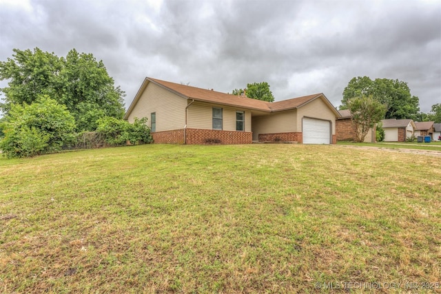 9207 S 92nd E Ave, Tulsa, OK 74133 - single story home featuring an attached garage, brick siding, and a front lawn