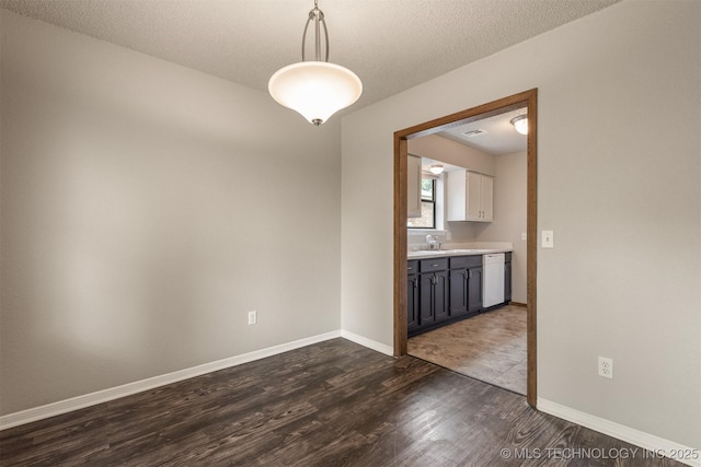 9207 S 92nd E Ave, Tulsa, OK 74133 - spare room with dark wood-style flooring and a textured ceiling